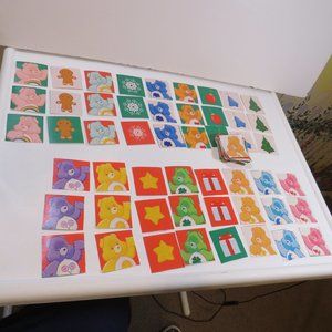 Care Bear wrapping paper squares 2 1/4 x 2ish (back of wrapping paper is white)